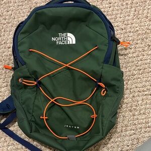 The North Face Forest Green Backpack with Bright Orange Details